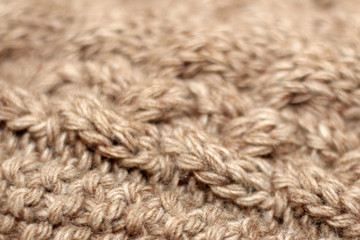 Fototapeta premium Beige knitted background medium thickness thread hobby leisure activity creativity coffee with milk abstract background