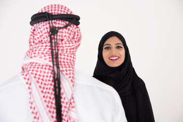 arab couple smiling and standing on white background