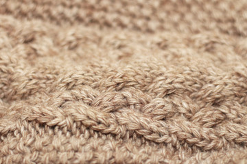 Beige knitted background medium thickness thread hobby leisure activity creativity coffee with milk abstract background