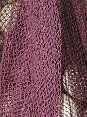 Marine networks Fishing equipment or rigging as texture background with natural light and shadow. Fishing nets and ropes for industrial fishing. fishing nets and buoys tackle for professionals.