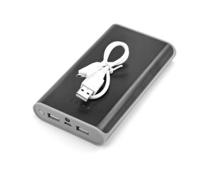 Black power bank Charger isolated on white background. Power bank for charging mobile devices. Smart phone charger with power bank (battery bank). External battery for mobile devices.