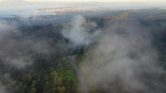 Aerial of clouds drifting over the East Bay hills in the San Francisco Bay area of California.