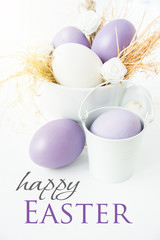 soft shades of purple and blue Easter eggs in the nest. happy easter wishes card 