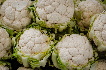 Pile of fresh cauliflower at food market