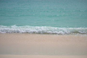 Fototapeta na wymiar wave crashing alon the shore on the island of barbuda