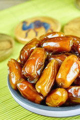 Sweet arabic algerian dates fruits on a ceramic plate