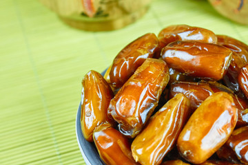 Sweet arabic algerian dates fruits on a ceramic plate