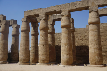Fototapeta premium Luxor, Egypt: Columns covered with hieroglyphs at Luxor Temple, built in 1400 BC on the east bank of the Nile River.