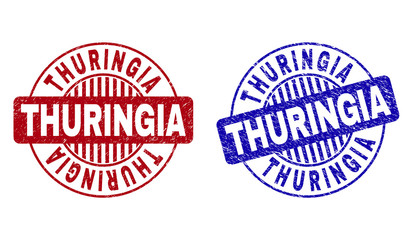 Grunge THURINGIA round stamp seals isolated on a white background. Round seals with grunge texture in red and blue colors. Vector rubber imitation of THURINGIA caption inside circle form with stripes.