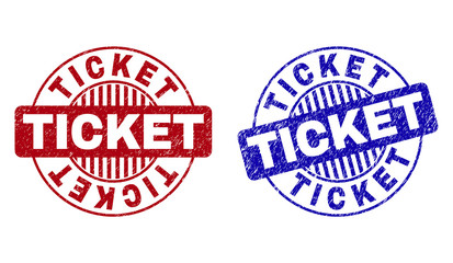 Grunge TICKET round stamps isolated on a white background. Round seals with grunge texture in red and blue colors. Vector rubber imprint of TICKET title inside circle form with stripes.