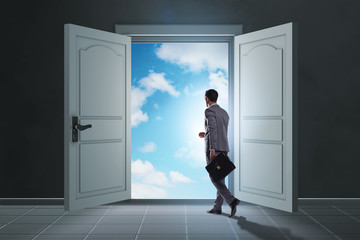 Fototapeta premium Businessman entering big large door