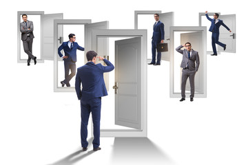 Fototapeta premium Businessman in uncertainty concept with many doors