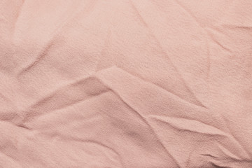 Beige pastel delicate pure textyle background of wavy viscose fabric