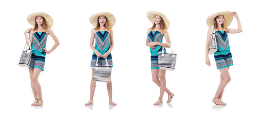 Fototapeta premium Pretty woman with summer handbag and panama isolated on white