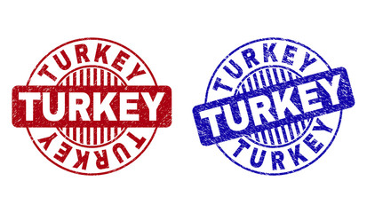 Grunge TURKEY round stamp seals isolated on a white background. Round seals with grunge texture in red and blue colors. Vector rubber imprint of TURKEY text inside circle form with stripes.
