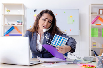 Young female designer working in the office 