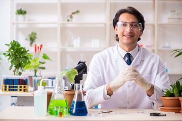 Biotechnology chemist working in lab