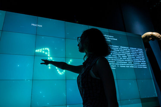 Russia, Vladivostok, July 2018: a girl near an interactive whiteboard in Vladivostok aquarium
