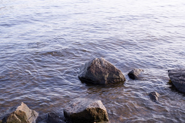 wet boulders in the water. nature, geologic.