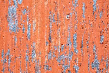 Peeling paint on sheet metal wall