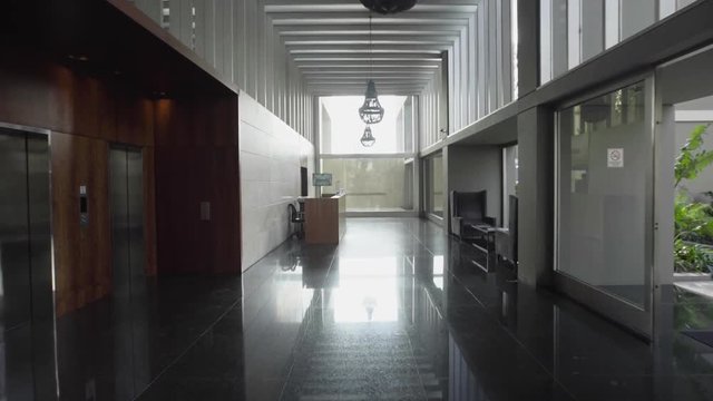 Point of view shot of empty corridor of modern hotel