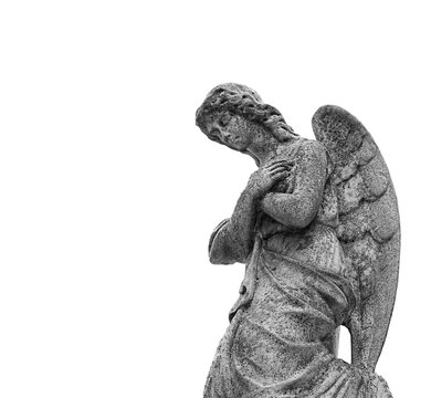 old stone statue of sad angel. stone memorial grieving angel statue on white background. concept of memory, religion. background for condolence, mourning card or obituary. Remember, mourn. copy space