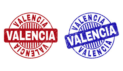 Grunge VALENCIA round stamp seals isolated on a white background. Round seals with grunge texture in red and blue colors. Vector rubber overlay of VALENCIA label inside circle form with stripes.