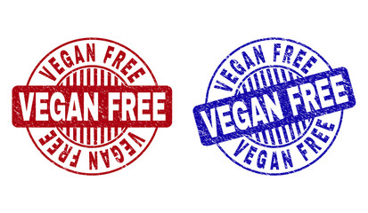Grunge VEGAN FREE round stamp seals isolated on a white background. Round seals with grunge texture in red and blue colors. Vector rubber imprint of VEGAN FREE title inside circle form with stripes.