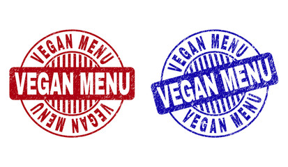Grunge VEGAN MENU round stamp seals isolated on a white background. Round seals with distress texture in red and blue colors.