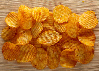 Texture fried golden brown potato chips, close-up
