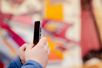 Hands young man phone for searching educating on Internet. Online bank, Internet security horizontal view