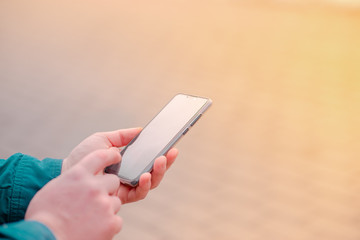 Hands young man phone for searching educating on Internet. Online bank, Internet security horizontal view