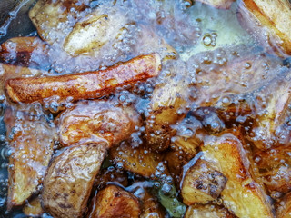 Obraz na płótnie Canvas French Fries Boiling In Hot Oil close up