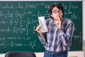 Funny male math teacher in the classroom 