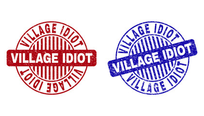Grunge VILLAGE IDIOT round stamp seals isolated on a white background. Round seals with grunge texture in red and blue colors.