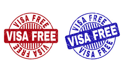 Grunge VISA FREE round stamp seals isolated on a white background. Round seals with grunge texture in red and blue colors. Vector rubber imprint of VISA FREE tag inside circle form with stripes.