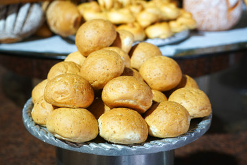 close up on fresh baked bread rolls in the plate