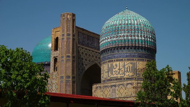 Steady, exterior, medium wide shot of the Bibi Khanym Mosque in Samarkand, Uzbekistan.