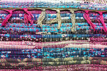 Needlework. Textile background with fabric texture with horizontal lines. A rug for home made from...