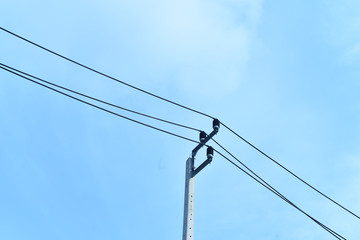 electric pole and wires with sky background