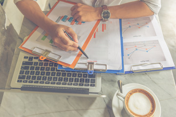 Office man checking  financial report document in the office