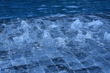water on surface of the swimming pool