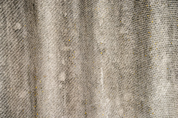 The texture of an old asbestos house roof in a village or an old