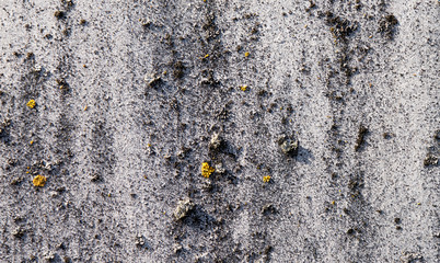 The texture of an old asbestos house roof in a village or an old