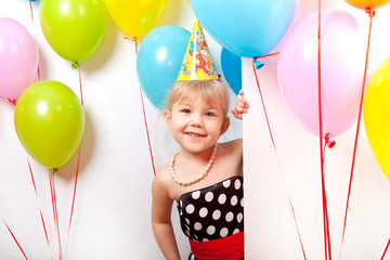 Portrait of a beautiful girl with a smile and balloons on white background