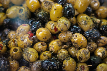  pile of olives at  market marinated olives with spices  and herbs