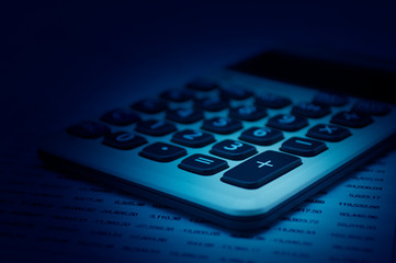 Calculator button plus on financial chart paper, Business success concept