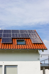 Fototapeta premium framing house with solar panels on rooftop