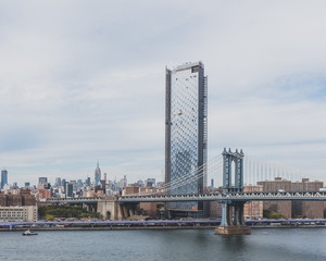 Manhattan Bridge over East River and buildings of Manhattan, in New York, USA