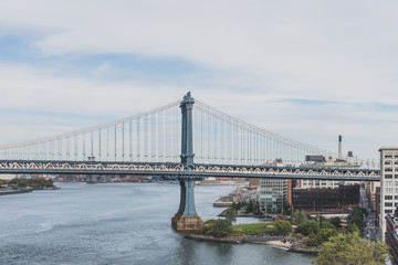 Manhattan Bridge over East River and Main Street Park, in Brooklyn, New York, USA